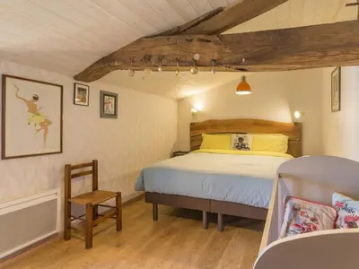 Un ou plusieurs lits dans un hébergement de l'établissement Maison charmante à Rouans - Wifi, Animaux admis - FR-1-306-1059