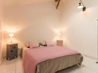 Un ou plusieurs lits dans un hébergement de l'établissement Gîte paisible à la campagne près de Pornic, jardin commun, wifi, idéal pour détente et loisirs - FR-1-306-1069
