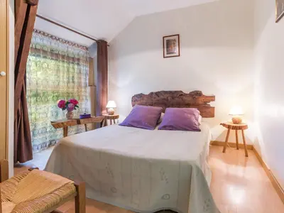 Un ou plusieurs lits dans un hébergement de l'établissement Gîte calme avec jardin clos, 3 chambres, équipements bébé, proche de Nantes et sites naturels - FR-1-306-1141