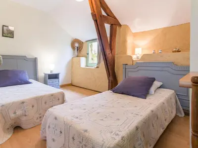 Un ou plusieurs lits dans un hébergement de l'établissement Gîte calme avec jardin clos, 3 chambres, équipements bébé, proche de Nantes et sites naturels - FR-1-306-1141