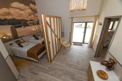 Un ou plusieurs lits dans un hébergement de l'établissement Les Chambres d'Aurore