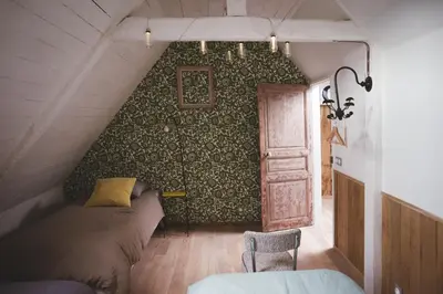 Coin salon dans l'établissement Chambres d'hôtes de charme - Gîtes cosy - LA CLE DES CHAMPS - A la campagne