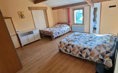 Un ou plusieurs lits dans un hébergement de l'établissement Chambres d hôtes Le Bois Corbeau