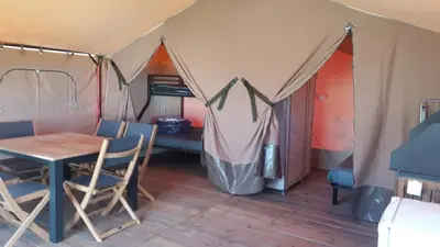 Un ou plusieurs lits dans un hébergement de l'établissement Lodge Les P'tites Maisons dans la Prairie