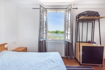 Un ou plusieurs lits dans un hébergement de l'établissement Gîte Monkey cottage