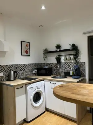 Cuisine ou kitchenette dans l'établissement Velours & Balnéo