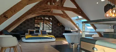 Coin salon dans l'établissement Apparthotel loft Martigné-Ferchaud