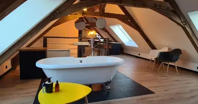 Coin salon dans l'établissement Apparthotel loft Martigné-Ferchaud