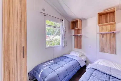 Un ou plusieurs lits dans un hébergement de l'établissement Nantes Camping Le Petit Port