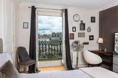 Un ou plusieurs lits dans un hébergement de l'établissement Appartement calme et cosy, Place du Ralliement