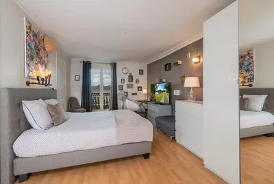 Un ou plusieurs lits dans un hébergement de l'établissement Appartement calme et cosy, Place du Ralliement