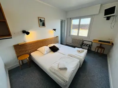 Un ou plusieurs lits dans un hébergement de l'établissement HOSTEL Les Bois Verts - Les Herbiers