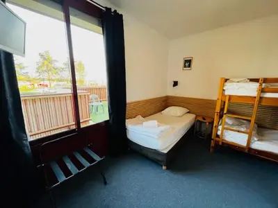 Un ou plusieurs lits dans un hébergement de l'établissement HOSTEL Les Bois Verts - Les Herbiers