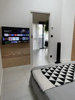 Télévision ou salle de divertissement dans l'établissement PLAISANCE Bouguenais - Appartement Nantes - PARKING GRATUIT