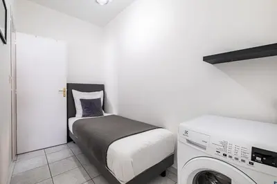 Un ou plusieurs lits dans un hébergement de l'établissement T2 au calme - Rond Point de Vannes