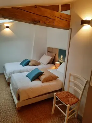 Un ou plusieurs lits dans un hébergement de l'établissement Gîte du Petit Moulin