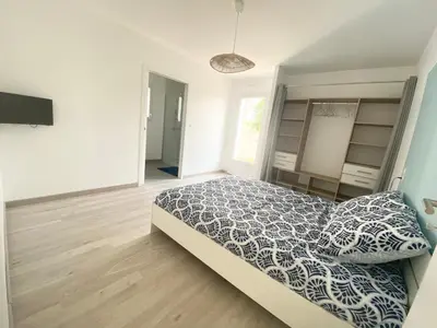Un ou plusieurs lits dans un hébergement de l'établissement Belle maison de 140m2, proche centre ville