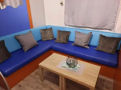Coin salon dans l'établissement Location mobil home