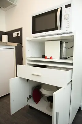 Cuisine ou kitchenette dans l'établissement Studio indépendant chez l’habitant au calme (n°2)