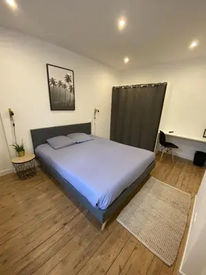 Un ou plusieurs lits dans un hébergement de l'établissement Appartement 97 M2 proche Puy du fou