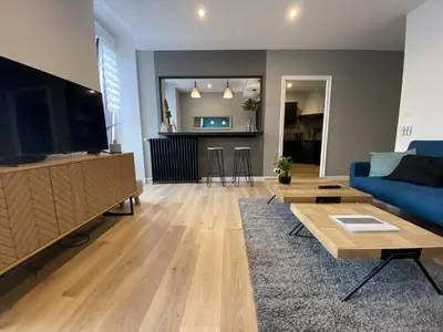 Télévision ou salle de divertissement dans l'établissement Appartement 97 M2 proche Puy du fou