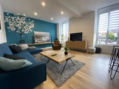 Télévision ou salle de divertissement dans l'établissement Appartement 97 M2 proche Puy du fou