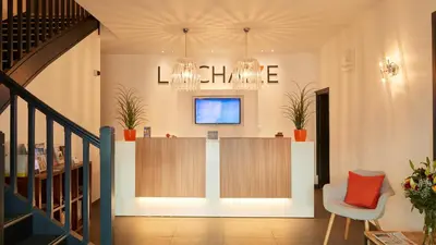 Télévision ou salle de divertissement dans l'établissement Résidence La Chaize