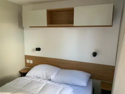 Un ou plusieurs lits dans un hébergement de l'établissement Mobil-home Dan Dom