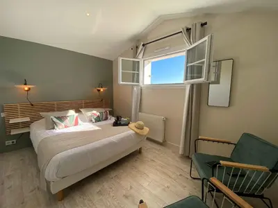 Un ou plusieurs lits dans un hébergement de l'établissement Une Escale à Pornic chambres d'hôtes 4 épis