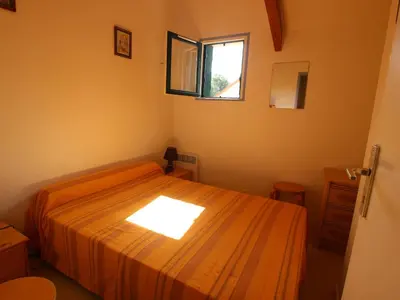 Un ou plusieurs lits dans un hébergement de l'établissement Maison de vacances à 50m de la mer - 4 personnes - FR-1-364-104