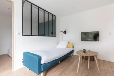 Un ou plusieurs lits dans un hébergement de l'établissement Logement confort moderne au pied du Front de Mer