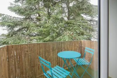 Jardin de l'établissement Logement confort moderne au pied du Front de Mer