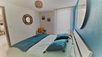 Un ou plusieurs lits dans un hébergement de l'établissement L'ESCAPADE maison 3 chambres plus mezzanine 8 à 10 personnes