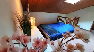 Un ou plusieurs lits dans un hébergement de l'établissement L'ESCAPADE maison 3 chambres plus mezzanine 8 à 10 personnes