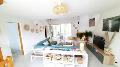 Coin salon dans l'établissement L'ESCAPADE maison 3 chambres plus mezzanine 8 à 10 personnes
