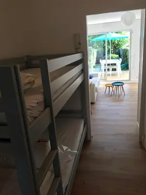 Un ou plusieurs lits dans un hébergement de l'établissement Studio Les Pétrels avec terrasse et jardinet à 2 pas de la plage
