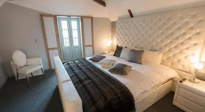 Un ou plusieurs lits dans un hébergement de l'établissement HÔTEL LES PALIS