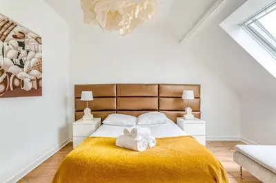 Un ou plusieurs lits dans un hébergement de l'établissement NYMPHÉA - Duplex Hauts Pavés