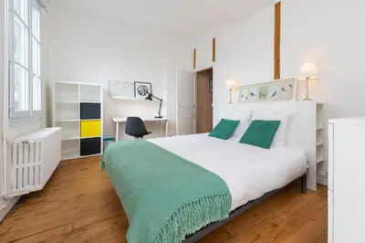 Un ou plusieurs lits dans un hébergement de l'établissement Appartement Coeur de Ville rue Saint-Laud