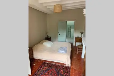Un ou plusieurs lits dans un hébergement de l'établissement LA PETITE MAISON de Chenillé Changé