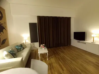 Télévision ou salle de divertissement dans l'établissement Appartement de standing dans le Golf International de La Baule
