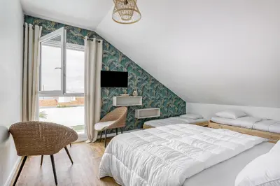 Un ou plusieurs lits dans un hébergement de l'établissement Magnifique villa pour grande famille à La Barre-de-Monts