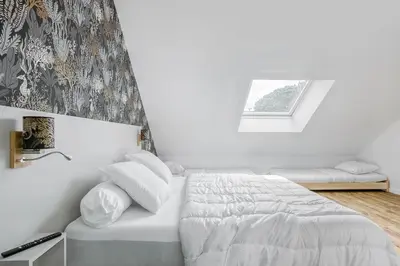Un ou plusieurs lits dans un hébergement de l'établissement Magnifique villa pour grande famille à La Barre-de-Monts