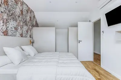 Un ou plusieurs lits dans un hébergement de l'établissement Magnifique villa pour grande famille à La Barre-de-Monts