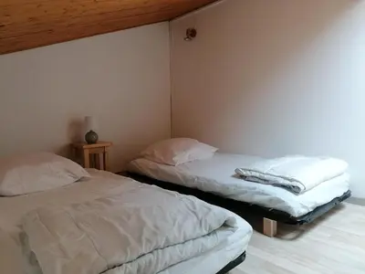 Un ou plusieurs lits dans un hébergement de l'établissement Maison dans les dunes