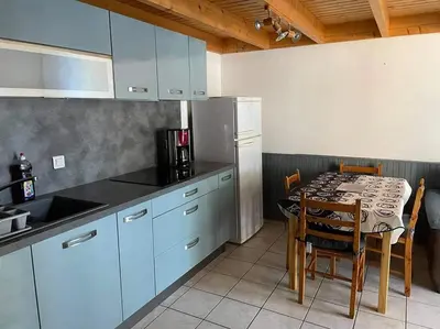 Cuisine ou kitchenette dans l'établissement Maison dans les dunes