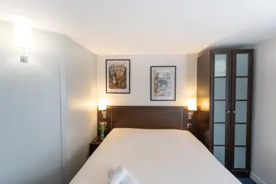 Un ou plusieurs lits dans un hébergement de l'établissement Hôtel Inn Design Carquefou