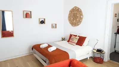 Un ou plusieurs lits dans un hébergement de l'établissement Appartement Hypercentre Calme proche Centre des Congrès
