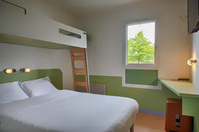 Un ou plusieurs lits dans un hébergement de l'établissement Ibis Budget Redon