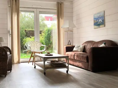 Coin salon dans l'établissement Bel appartement en rez-de-jardin à 100m des plages